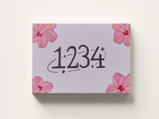 Small box with floral design and angel numbers 1234 on a pink background